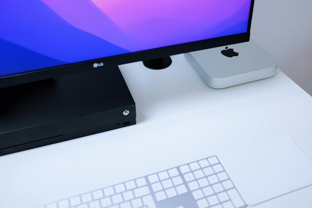 a computer monitor sitting on top of a white desk